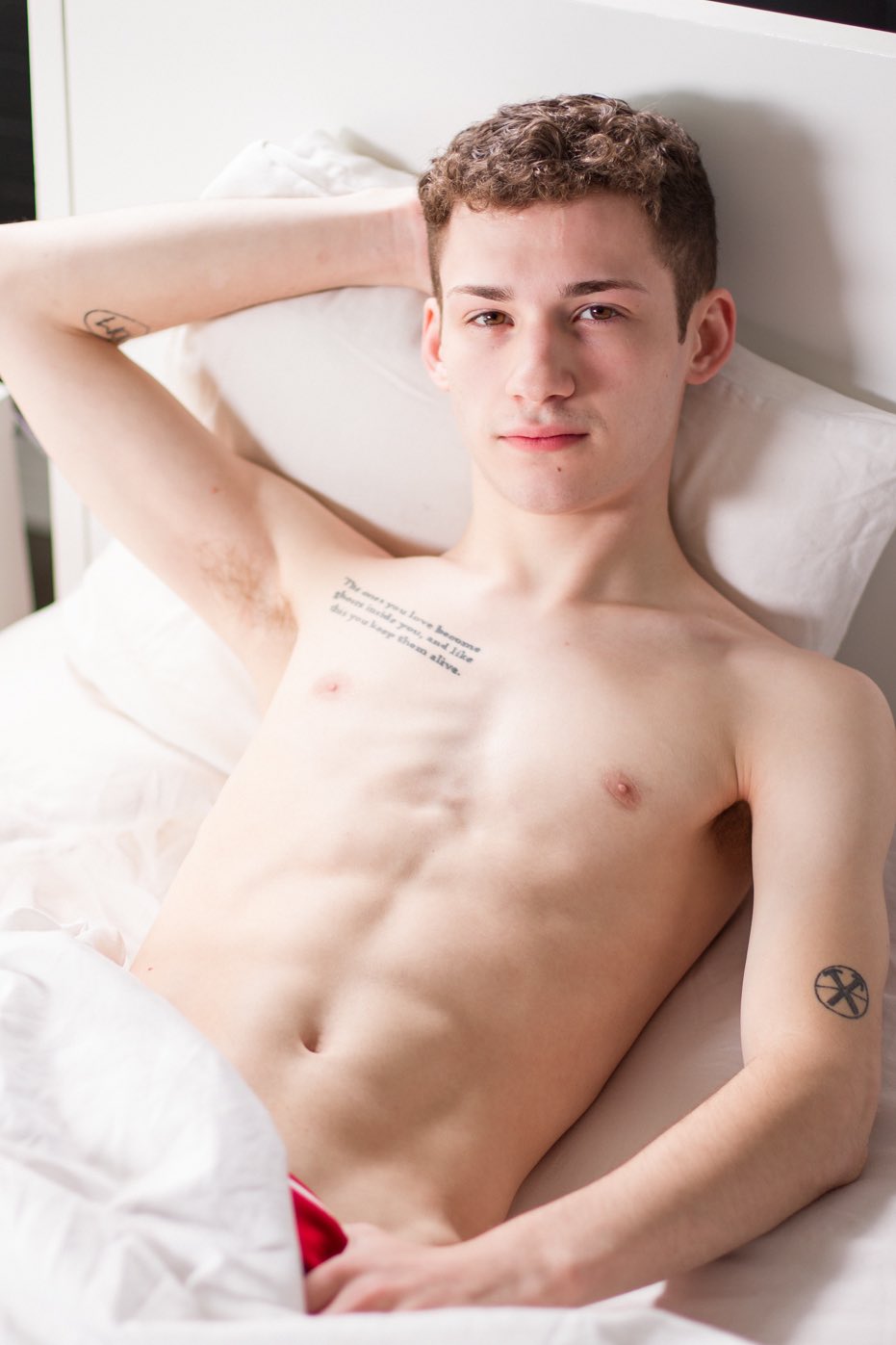 A fit and muscular male model with a clean-cut All-American look, reflecting the athletic and charismatic presence of Danny Nelson.