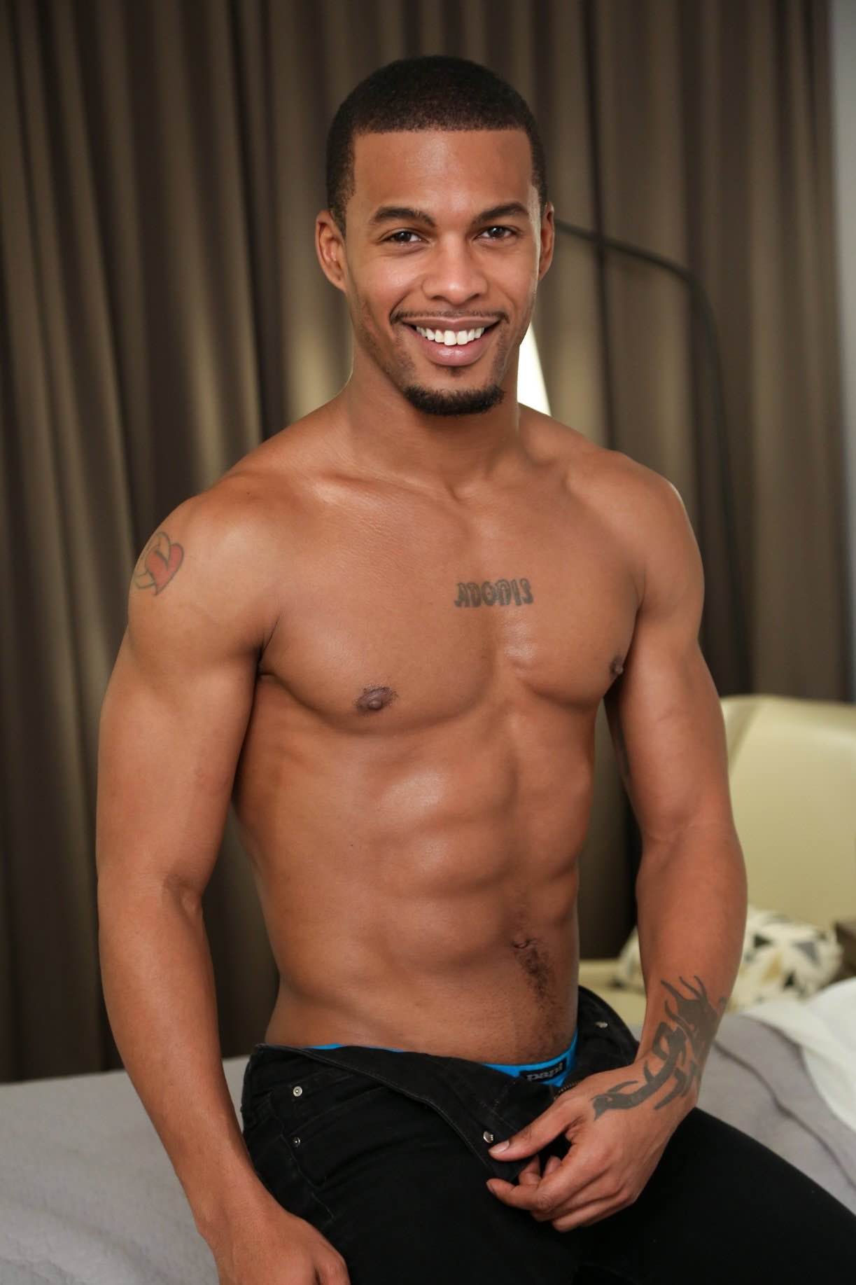 A confident and athletic male model with a stylish urban look, reflecting the charismatic and professional presence of Jacen Zhu.