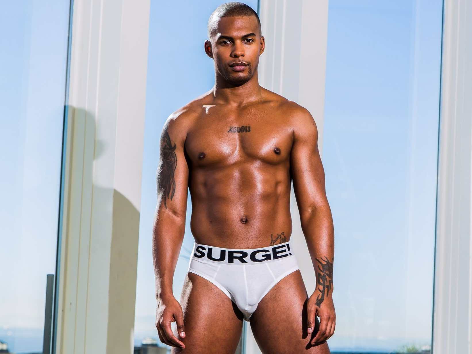 An athletic and sophisticated male influencer managing his digital presence, capturing the professional spirit of Jacen Zhu.